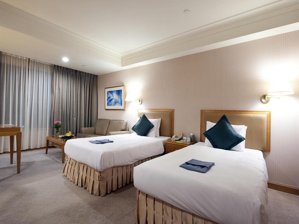 85 Sky Tower Hotel Kaohsiung Rum bild Deluxe Room